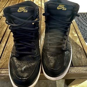 Size 10.5 Air Jordan black white and gold shoe